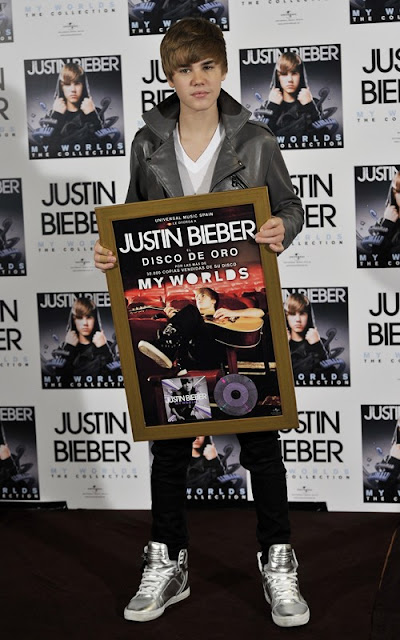 Justin Bieber being presented a gold album in Madrid, Spain photo
