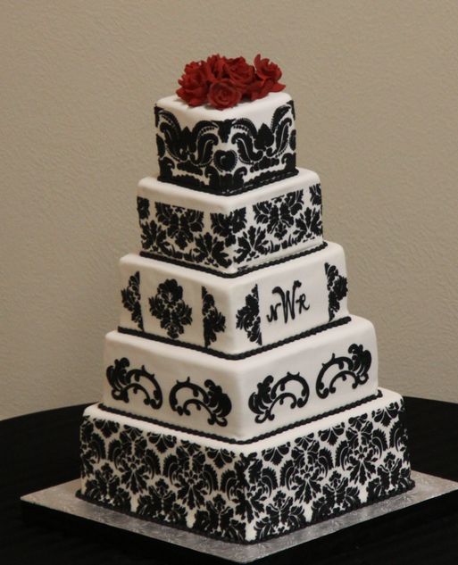 Black and white wedding cakes with square tiers and damask pattern