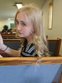 Teenage girl looking over her shoulder