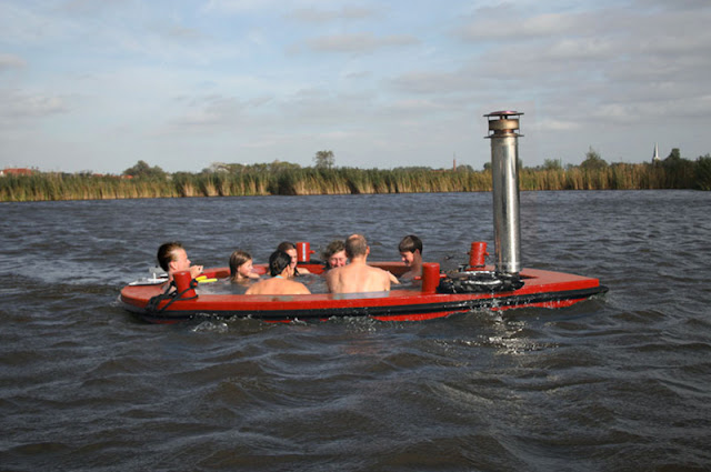 http://www.ifitshipitshere.com/the-hottug-a-motorized-floating-wood-fired-hot-tub/