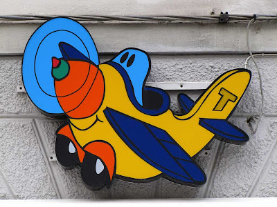 Toy plane, shop sign, Livorno