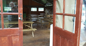 Knowsley Safari covered huts for eating and shelter with lots of chairs and tables