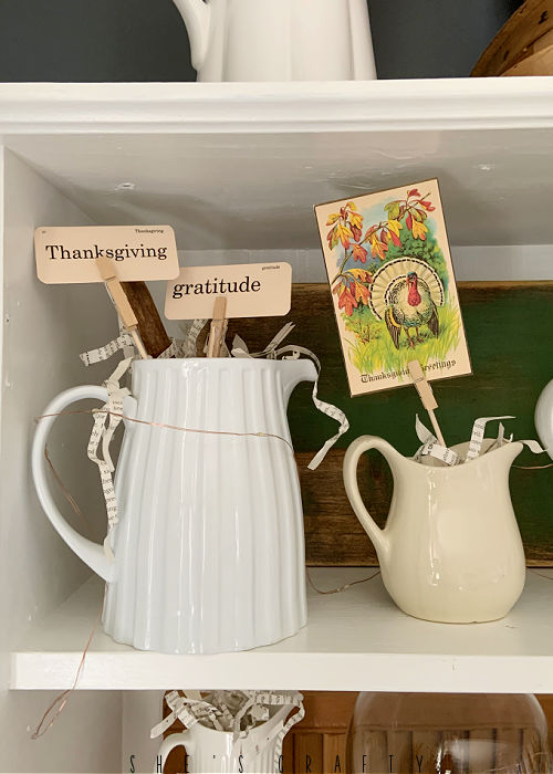 Thanksgiving printables in vintage pitchers and creamers.
