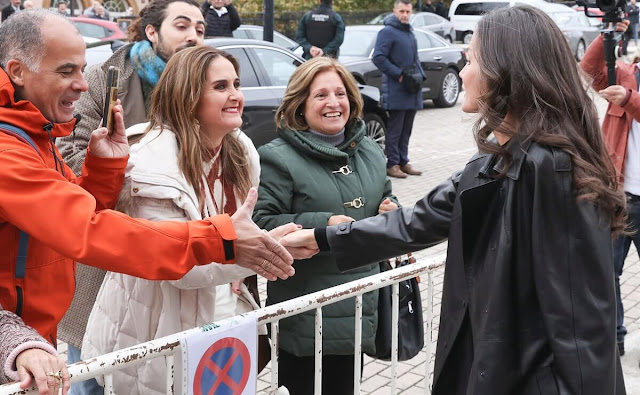 Queen Letizia wore a new Berlin black lamb leather trench coat by Lottusse. Pomandere slightly wide leg cut and pleats trousers