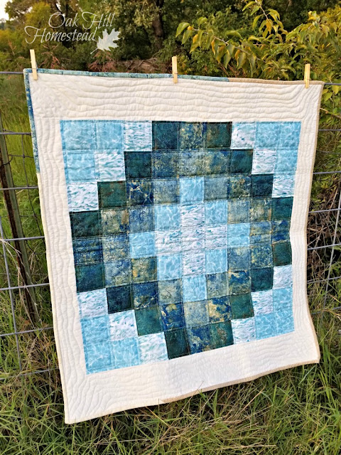 Stitching is soothing and keeps my hands occupied in the evenings. This baby quilt is named "Tide Pool."