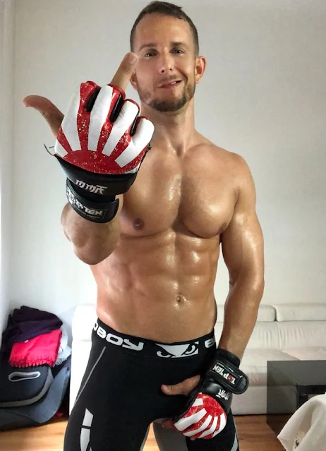 Absoluteperfection giving the middle finger wearing workout gloves