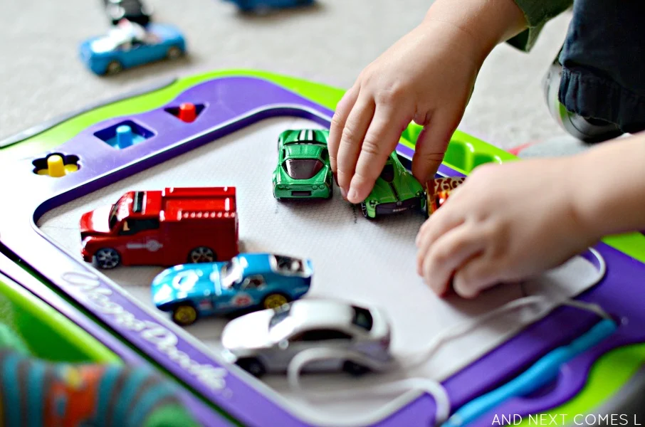 Open-ended play for kids with cars and a Magna-Doodle from And Next Comes L