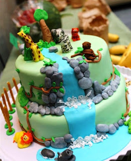 Ide kreatif kue ulang tahun pertama anak tema air terjun dan hewan