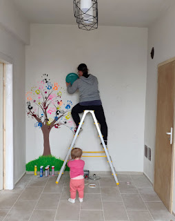 Beginning to draw the circles on the wall