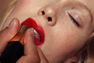 top beauty photographers nyc, applying red lipstick