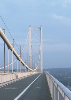 Mid-span view of a tower and cables of the Forth Road Bridge from the west side walkway, looking south; Queensferry, Scotland