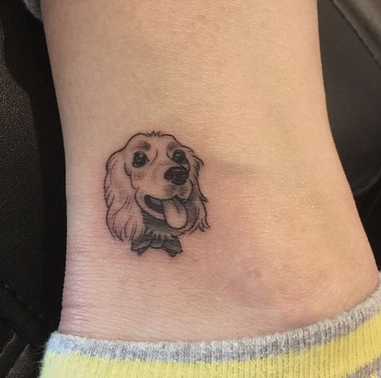 Outro pequeno cão tatuagem no tornozelo