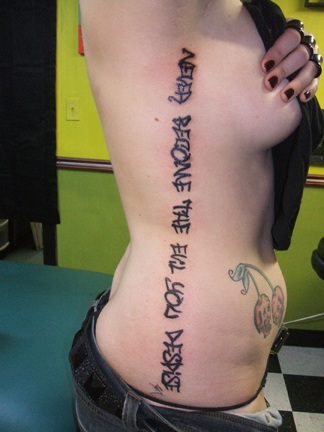 tattoos for girls on ribs. rib tattoo ideas. tattoo text