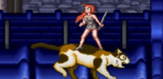 Shows Animated woman with ginger hair and silver sword in her and silver top on and shows her riding a brown,black,white giant cat  on blue building below both the lady and cat and shows rock on the of the screen.png