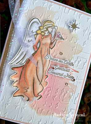 The Angel of Peace heralds "Peace on Earth, Goodwill to all Men", being displayed on a watercolour embossed background, by Andrea Sargent, Australia