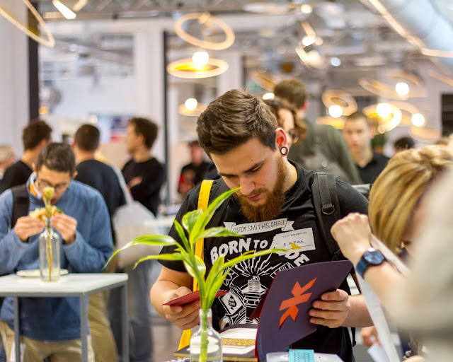 A man browsing products at a fair.