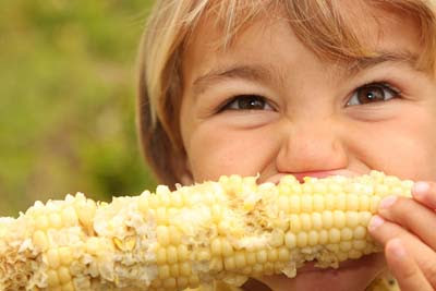 boy eating corn