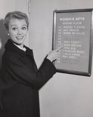 Actress Inger Stevens points to her name on a list.