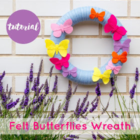 Yarn-wrapped wreath decorated with felt butterflies 