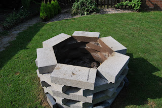 firepit made out of breeze blocks stacked in a hexagonal shape by Meera LYNN