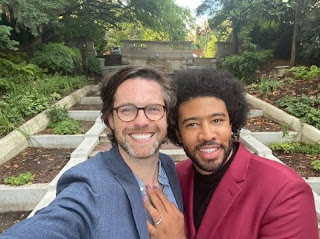 Eugene Daniels clicking a selfie with his partner Nate Stephens