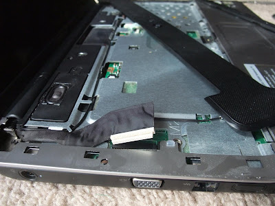 how to fix a broken laptop screen, push in ribbon cable in case, under keyboard