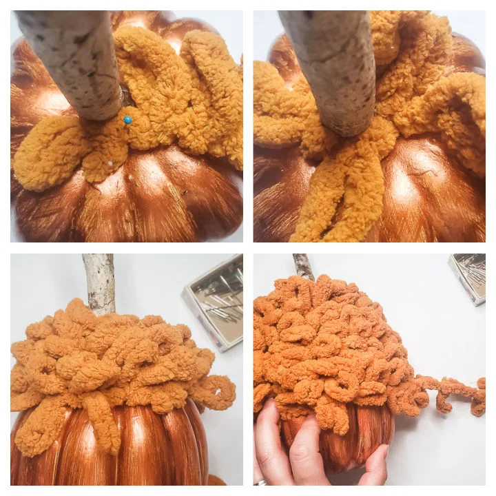 pin loop yarn to foam pumpkin and keep wrapping and pinning yarn in place
