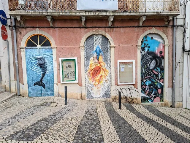 Doors covered in street art in Sesimbra on the Peninsula de Setúbal