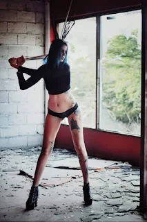 " Tattiana Rosric modeling with a bat"