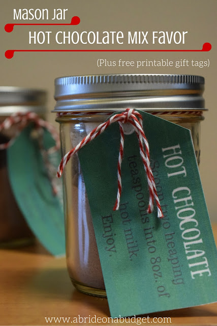 Hot chocolate is a PERFECT winter wedding favor. Find out how to make these Mason Jar Hot Chocolate Mix Favors, and get a free printable gift tag, from www.abrideonabudget.com.