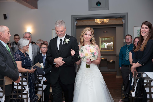 bride walking down the isle at Noah's Event Venue in Auburn Hills Michigan