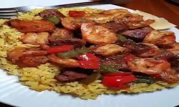 Haul steak and shrimp over unheroic rice