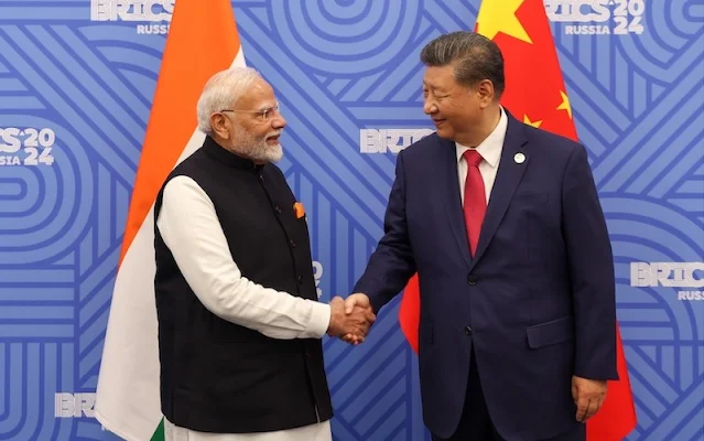 Cover Image Attribute: Indian Prime Minister Narendra Modi (L) shaking hands with Chinese President Xi Jinping before their meeting at the BRICS Summit in Kazan, Russia, on October 23, 2024. / Source: X