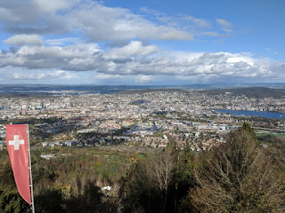 Swiss flag banner atop the Uetliberg, view overlooking Zürich, Switzerland