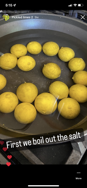 a large pot filled with water and yellow limes. text on the image says "first we boil out the salt"