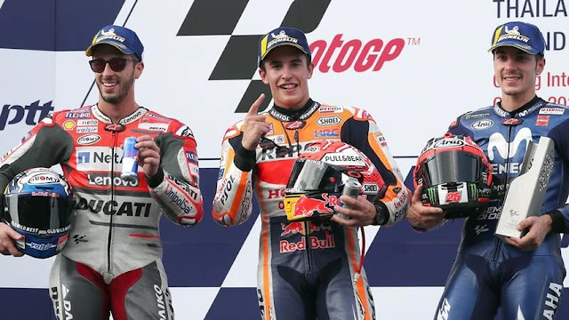 Marc Marquez (C), Andrea Dovizioso (L) and Maverick Vinales (R) on the podium at the Thai MotoGP