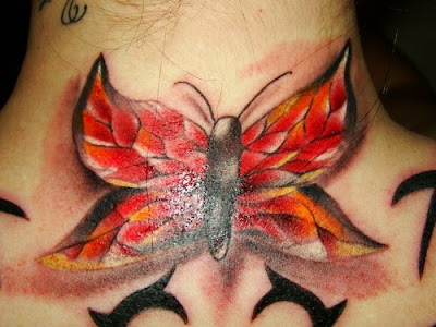 Label: red tribal butterfly back tattoo
