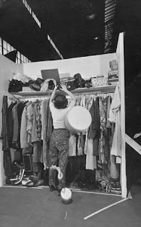 BW Photo of a woman sorting her closet