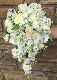 White Wedding Cascading Bridal Bouquet with roses, lilies, and stock flowers