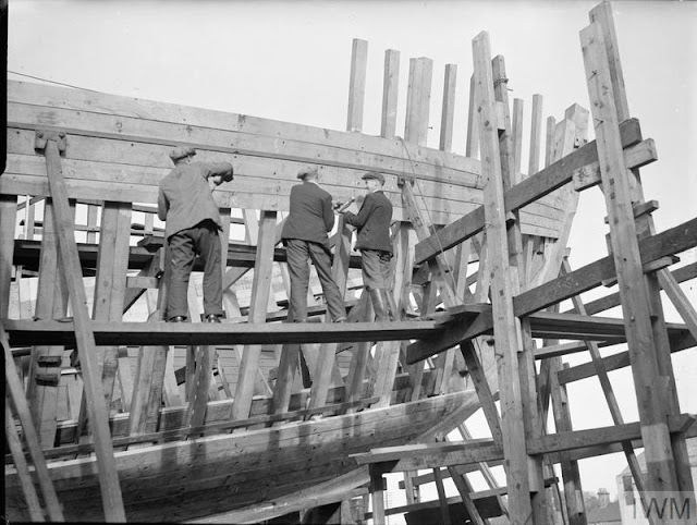 Wooden minesweepers being built at a shipyard in Brightlingsea and Saxmundham.