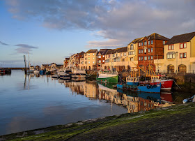 Photo of colourful fishing boats in Maryport Harbour