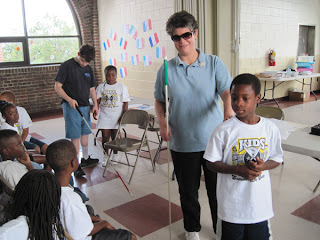 Laurel teaches sighted guide to summer day campers