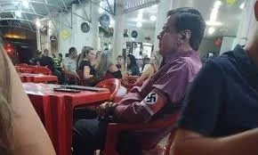 Homem  da suástica no braço em MG vira réu por apologia ao nazismo.