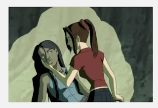 Kitty cradling Danielle's face while the two of them stuck in a cave.