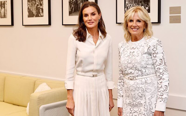 Queen Letizia wore a new Dakota crepe shirtdress by Ralph Lauren Collection. First Lady Jill Biden wore a white lace dress