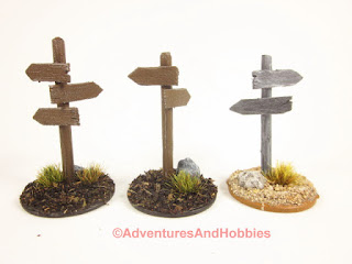 Group of three wooden roadside sign posts for 25-28mm scale miniature wargaming.