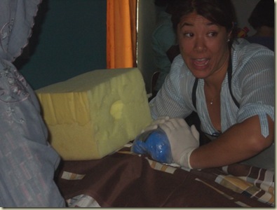Angie teaching how to manage post-partum hemorrhage- not the high tech training tools we have_sm