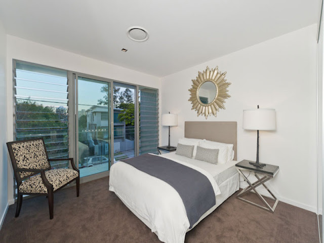 Photo of modern bed in smaller bedroom of contemporary home in Brisbane