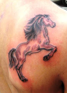 http://allaboutbodyart.blogspot.com/ - Horse Tattoo symbol tattoo back tattoo