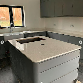 quartz worktop on kitchen island, space for hob and socket